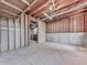 Unfinished basement features concrete floors and walls, and exposed utilities for a customizable space at 423 Eagle Ridge Trl, Canton, GA 30114