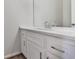 Bathroom with white cabinets, quartz countertop, and modern chrome fixtures, providing a clean and elegant aesthetic at 423 Eagle Ridge Trl, Canton, GA 30114