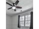 Bedroom with neutral walls has two windows and a ceiling fan providing natural light at 423 Eagle Ridge Trl, Canton, GA 30114