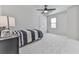 Bedroom with neutral walls has carpeted floors, a bed, and a ceiling fan at 423 Eagle Ridge Trl, Canton, GA 30114