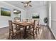 Open-concept dining room with hardwood floors and stylish decor leading to kitchen at 423 Eagle Ridge Trl, Canton, GA 30114