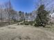 Expansive front yard with a long driveway, complemented by mature trees and landscaping at 423 Eagle Ridge Trl, Canton, GA 30114