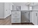 Kitchen with white cabinets, quartz countertop, and stainless steel dishwasher at 423 Eagle Ridge Trl, Canton, GA 30114