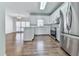 Modern kitchen with stainless steel appliances, white cabinetry, and a view to dining at 423 Eagle Ridge Trl, Canton, GA 30114