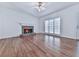 Sunlit living room with fireplace and hardwood floors at 423 Eagle Ridge Trl, Canton, GA 30114