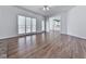 Bright living room featuring hardwood floors and a large window, creating a warm and inviting atmosphere at 423 Eagle Ridge Trl, Canton, GA 30114
