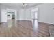 Open-concept living room with hardwood floors, seamlessly connecting to the kitchen for modern living at 423 Eagle Ridge Trl, Canton, GA 30114