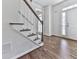 Hardwood staircase and floors create a bright and inviting entrance area at 423 Eagle Ridge Trl, Canton, GA 30114