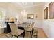 Elegant dining room with coffered ceilings, a modern chandelier, and ample space for entertaining at 4540 Brighton View Trl, Cumming, GA 30040