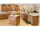 Spacious kitchen featuring wood cabinets, granite countertops, stainless steel appliances, and an island at 4540 Brighton View Trl, Cumming, GA 30040