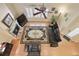Open-concept living room with fireplace, high ceilings, lots of natural light, and hardwood floors at 4540 Brighton View Trl, Cumming, GA 30040