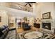 Inviting living room boasting a stone fireplace, an open layout, and a view to the kitchen at 4540 Brighton View Trl, Cumming, GA 30040