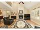 Spacious living room with a stone fireplace, high ceilings, and an open view to the upstairs loft at 4540 Brighton View Trl, Cumming, GA 30040