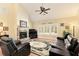 Comfortable living room featuring a cozy fireplace, plush seating, and a bright, airy ambiance at 4540 Brighton View Trl, Cumming, GA 30040