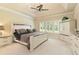 Spacious main bedroom featuring tray ceilings, neutral tones, and a large window with plantation shutters at 4540 Brighton View Trl, Cumming, GA 30040