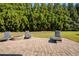 Beautiful brick patio with fire pit and chairs perfect for relaxing outdoors at 4540 Brighton View Trl, Cumming, GA 30040