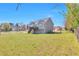 Spacious backyard featuring a wooden deck and lush green lawn at 1515 Summer Lake Ter, Loganville, GA 30052