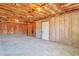 Unfinished basement with concrete floor and exposed insulation, ready for customization at 1515 Summer Lake Ter, Loganville, GA 30052