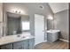 Bright primary bathroom with double sinks and vanities at 1515 Summer Lake Ter, Loganville, GA 30052