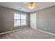Bedroom featuring a window and a door at 1515 Summer Lake Ter, Loganville, GA 30052