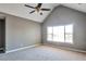 Spacious bedroom features vaulted ceiling, ceiling fan, and large window at 1515 Summer Lake Ter, Loganville, GA 30052