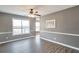Elegant dining room featuring stylish trim and large windows offering natural light at 1515 Summer Lake Ter, Loganville, GA 30052