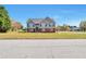 Inviting two-story home with a well-manicured lawn in a suburban setting at 1515 Summer Lake Ter, Loganville, GA 30052