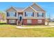 Charming two-story home featuring a brick facade and inviting front entrance at 1515 Summer Lake Ter, Loganville, GA 30052