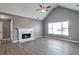 Bright living room with vaulted ceiling, fireplace, and large windows at 1515 Summer Lake Ter, Loganville, GA 30052