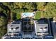 Aerial view of condominium building with a pool and manicured landscaping at 2500 Peachtree Nw Rd # 207S, Atlanta, GA 30305