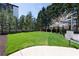 Expansive backyard with well-maintained lawn, mature trees, and manicured hedges at 2500 Peachtree Nw Rd # 207S, Atlanta, GA 30305