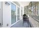 Charming balcony with seating, a table, and a view of the trees at 2500 Peachtree Nw Rd # 207S, Atlanta, GA 30305