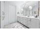 Bathroom features marble countertops, dual sinks, and ample cabinet storage at 2500 Peachtree Nw Rd # 207S, Atlanta, GA 30305