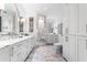 Bright bathroom with marble countertops, dual sinks, and a walk-in shower at 2500 Peachtree Nw Rd # 207S, Atlanta, GA 30305