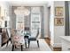 Cozy dining area with crystal chandelier, floral chairs, and elegant decor at 2500 Peachtree Nw Rd # 207S, Atlanta, GA 30305