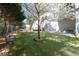 Dog park area with artificial grass, seating, and mature trees at 2500 Peachtree Nw Rd # 207S, Atlanta, GA 30305