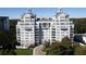 Elegant luxury building with manicured landscaping and circular driveway at 2500 Peachtree Nw Rd # 207S, Atlanta, GA 30305