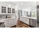 Bright kitchen with white cabinetry, stainless steel appliances, and an open concept design at 2500 Peachtree Nw Rd # 207S, Atlanta, GA 30305