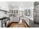 Bright kitchen featuring white cabinetry, stainless steel appliances, and a view of the dining area at 2500 Peachtree Nw Rd # 207S, Atlanta, GA 30305