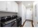 Modern laundry room features new washer and dryer, storage cabinets, and easy access at 2500 Peachtree Nw Rd # 207S, Atlanta, GA 30305