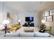 Inviting living room featuring a modern entertainment center, plush seating, and contemporary art at 2500 Peachtree Nw Rd # 207S, Atlanta, GA 30305