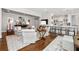 Bright, open living room leading to a modern kitchen with a breakfast bar and stylish decor at 2500 Peachtree Nw Rd # 207S, Atlanta, GA 30305