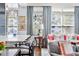 Chic living room with a breakfast bar, bright windows, and stylish interior design at 2500 Peachtree Nw Rd # 207S, Atlanta, GA 30305