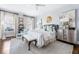 Comfortable main bedroom features neutral tones, a plush rug, and a seating area at 2500 Peachtree Nw Rd # 207S, Atlanta, GA 30305