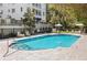 Relaxing community pool area with comfortable seating and shaded umbrellas at 2500 Peachtree Nw Rd # 207S, Atlanta, GA 30305