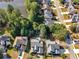 Aerial view of a home with a pool in a neighborhood adjacent to the lake at 152 Vinings Lake Ct, Mableton, GA 30126