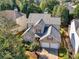 Beautiful two-story home with lush landscaping, brick accents, and convenient two-car garage at 152 Vinings Lake Ct, Mableton, GA 30126