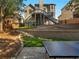 Expansive backyard with lush landscaping, stone retaining wall and stairs to upper deck at 152 Vinings Lake Ct, Mableton, GA 30126