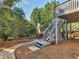 Scenic backyard with steps and lower patio, great for outdoor entertaining and relaxing at 152 Vinings Lake Ct, Mableton, GA 30126
