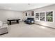 Spacious basement area with a pool table, comfortable seating, and natural light at 152 Vinings Lake Ct, Mableton, GA 30126